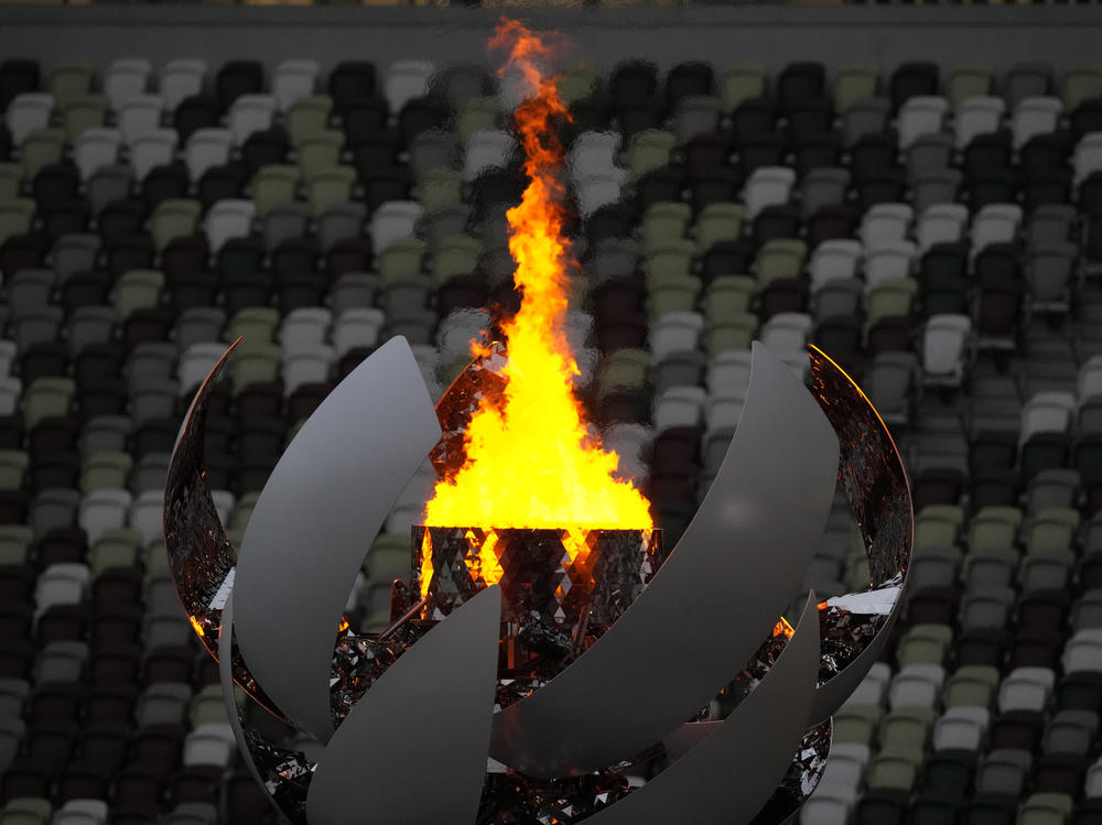 The Olympic flame burns prior to the Closing Ceremony in the Olympic Stadium at the Summer Olympics on Sunday in Tokyo.