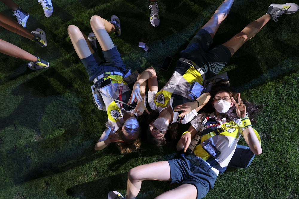 Athletes of Australia pose during the closing ceremony in the Olympic Stadium at the Summer Olympics in Tokyo.