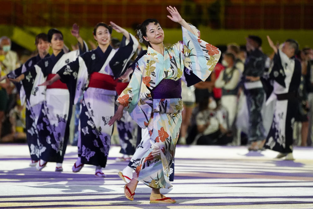 Artists perform during the closing ceremony in the Olympic Stadium at the Summer Olympics in Tokyo.