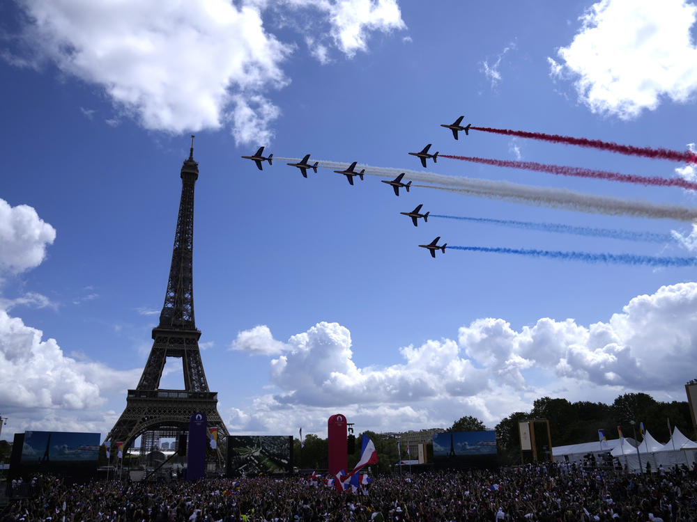 The French Aerial Patrol fly by the Eiffel Tower in Paris as part of the handover ceremony of Tokyo 2020 to Paris 2024, as Paris will be the next Summer Games host in 2024.