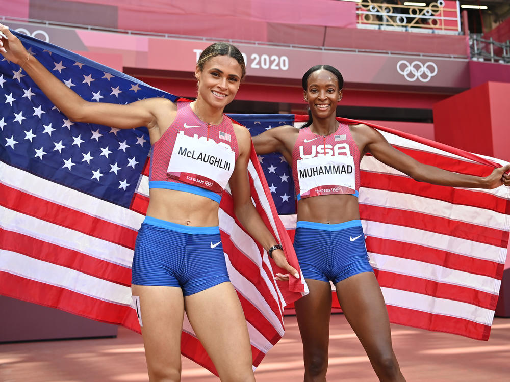 Team USA topped the medals list at the Tokyo Games, narrowly edging China in golds. Here, track stars Sydney McLaughlin (left) and Dalilah Muhammad celebrate winning gold and silver respectively in the women's 400-meter hurdles in Tokyo.
