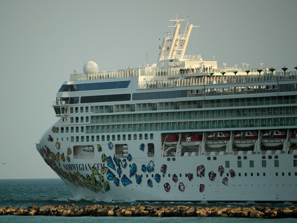 The Norwegian Gem cruise ship leaves the Port of Miami in April 2020. The Norwegian Gem's first trip since a pandemic-induced hiatus is scheduled to sail from Miami on Aug. 15.