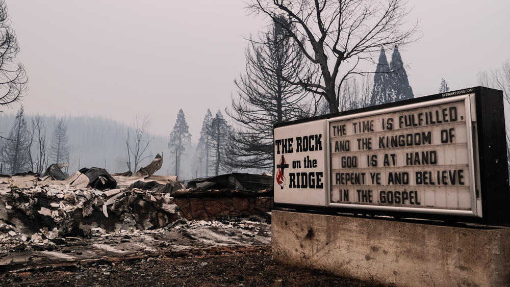 The remains of a church destroyed by the Dixie Fire are seen along Highway 89 on Sunday in Greenville, Calif. The fire has incinerated nearly 500,000 acres.