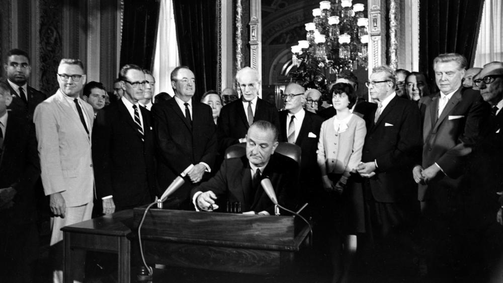 President Lyndon B. Johnson signs the Voting Rights Act into law on Aug. 6, 1965.