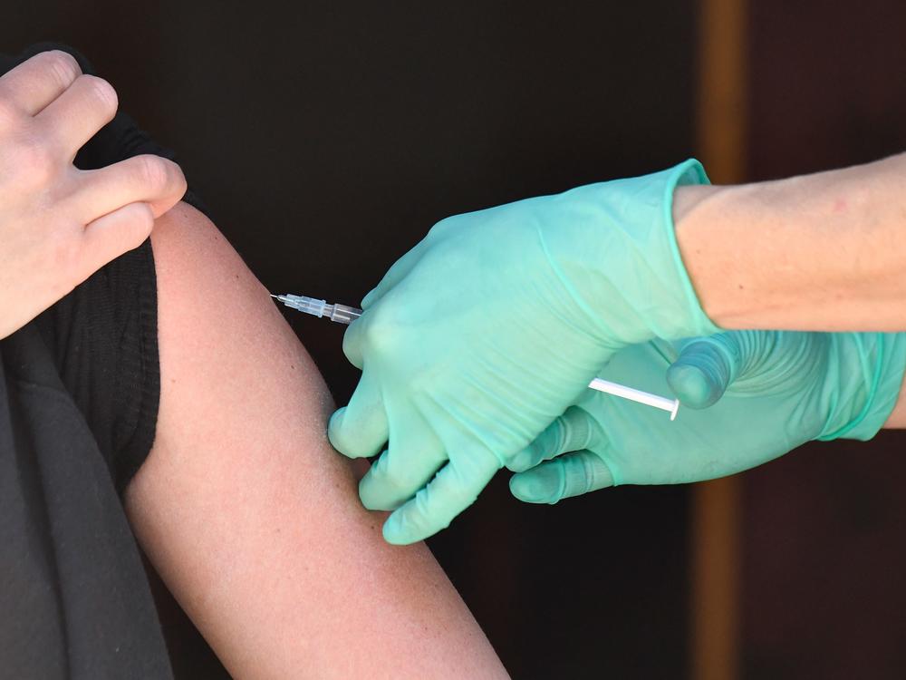 A medical assistant administers the Johnson & Johnson COVID-19 vaccine in May in Berlin's Friedrichshain district.