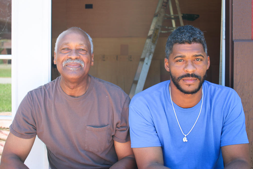 Cairo residents Lee Wright and son Roman Wright take a break from construction work earlier this summer. Both decided not to get vaccinated. 