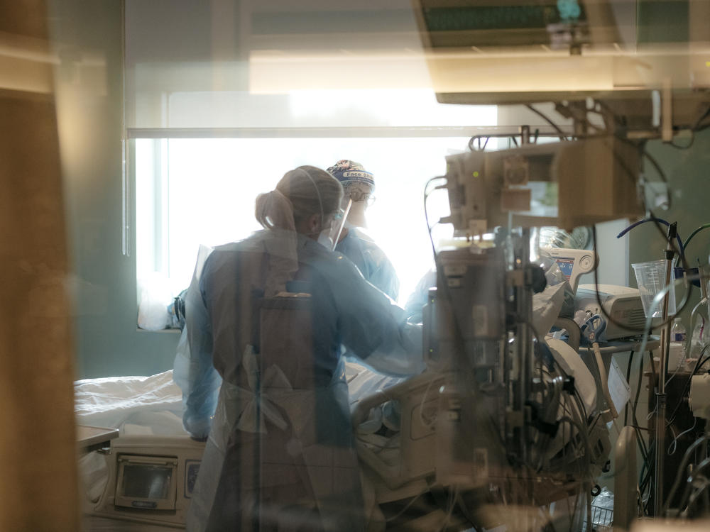 Nurses check on a patient in the intensive care unit COVID-19 ward last week at NEA Baptist Memorial Hospital in Jonesboro, Ark. The delta variant is driving up case counts and overwhelming hospitals across the South.