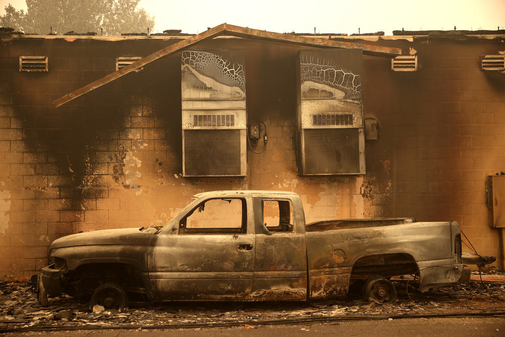 A burned truck sits parked next to a property that was destroyed by the Dixie Fire on August 11, 2021, in Greenville, California. The Dixie Fire, which has incinerated over 500,000 acres, is the second-largest recorded wildfire in state history. The fire stands at 30 percent contained.
