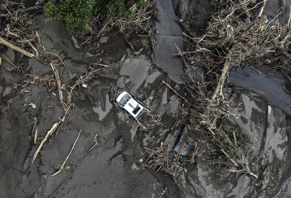 An aerial photo shows the destruction after floods and mudslides killed about three dozens of people, in Bozkurt town of Kastamonu province, Turkey, Friday, Aug. 13, 2021. The death toll from devastating floods and mudslides in northern Turkey rose to at least 31 on Friday, officials said, as emergency services searched for survivors in collapsed buildings or swamped homes, shops and basements.