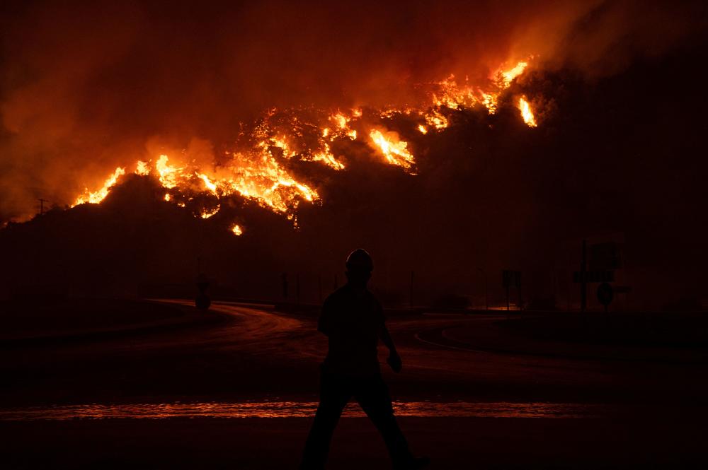 Raging fires burn close to the Kemerkoy Thermal Power Plant, at Oren near the town of Milas on August 4, 2021. The thermal power plant on the Aegean Sea was being evacuated, as a deadly wildfire that has raged across the country for the past week reached its edge.