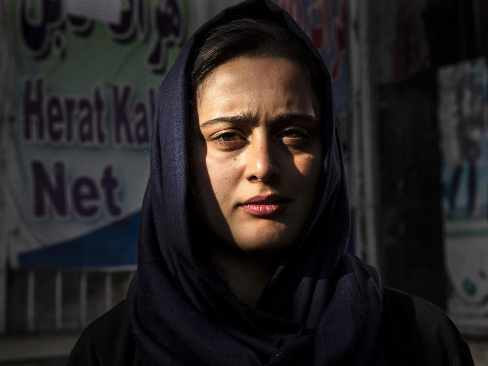 Dawlatt Naimati, 22, from Kunduz, stands outside an internet café where she is seeking help applying for a U.S. special immigrant visa on Aug. 8, in Kabul, Afghanistan.