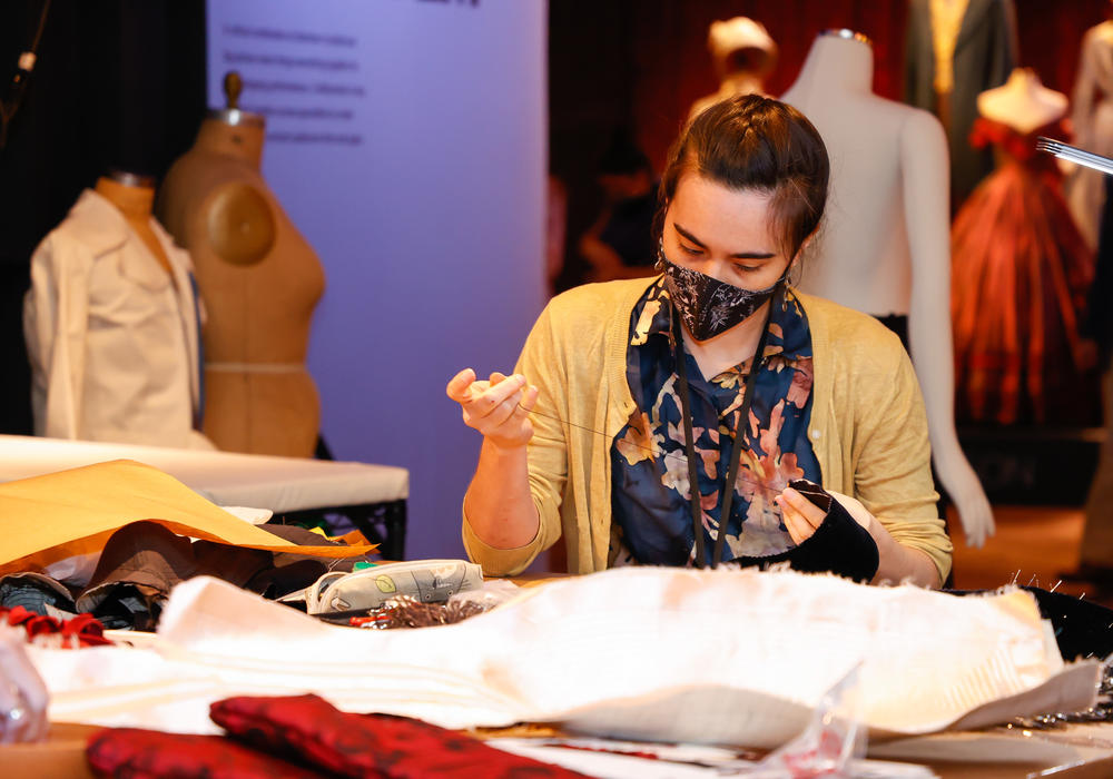 Gillian Conahan works at the <em>Showstoppers! </em>exhibition on Aug. 4, 2021, in New York City.