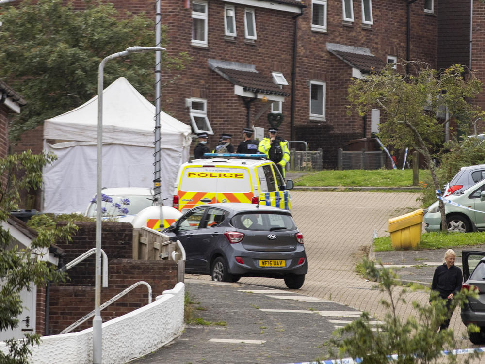 Police work the scene after a deadly shooting in Plymouth, England, on Thursday.
