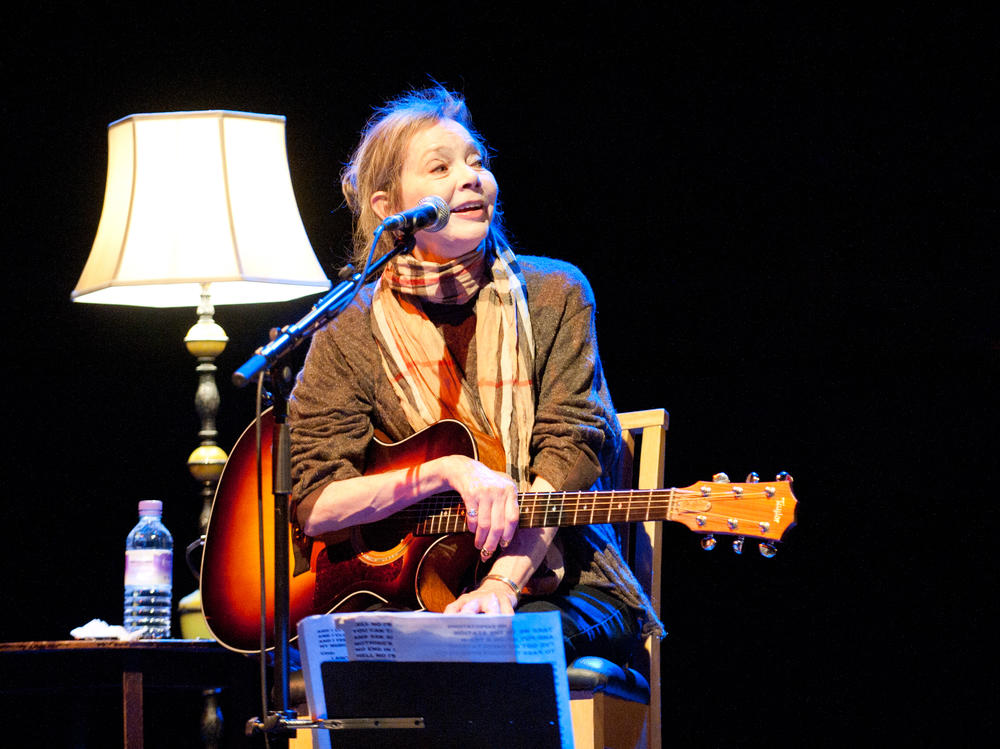 Nanci Griffith performs in London in 2012. She died Friday in Nashville at age 68.