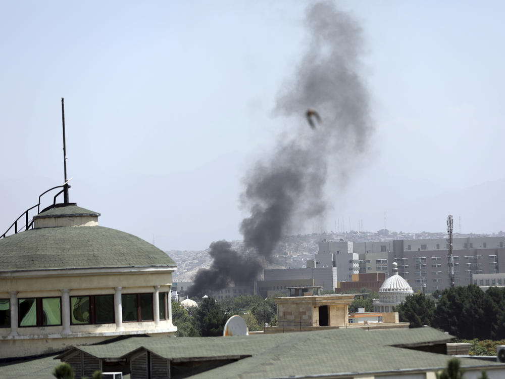 Smoke rises next to the U.S. Embassy in Kabul, on Sunday. Taliban fighters have entered the outskirts of the Afghan capital, further tightening their grip on the country.