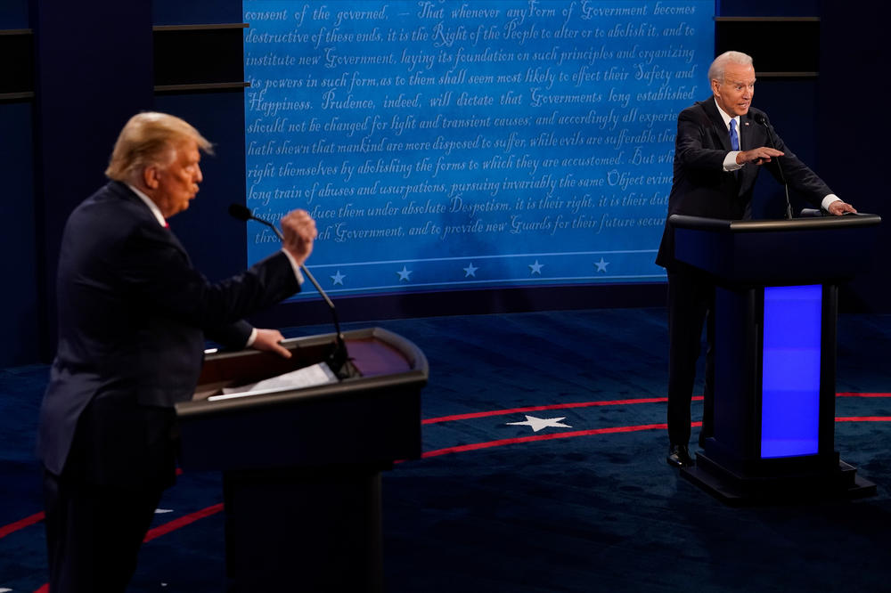 Then-Democratic presidential candidate Joe Biden answers a question as President Donald Trump listens during their second debate in October.