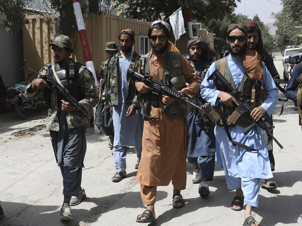 Taliban fighters patrol in the Wazir Akbar Khan neighborhood in the city of Kabul, Afghanistan, Wednesday, Aug. 18, 2021 as they seek to convince a wary population that they have changed.