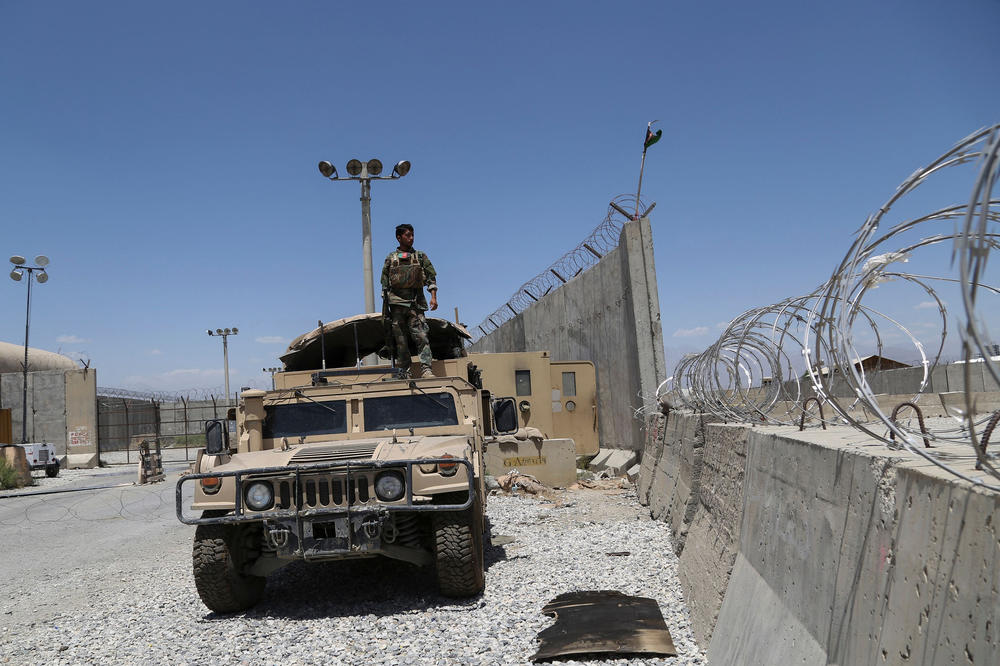 An Afghan National Army soldier stands on a Humvee at Bagram Air Base after all U.S. and NATO troops left, in July.