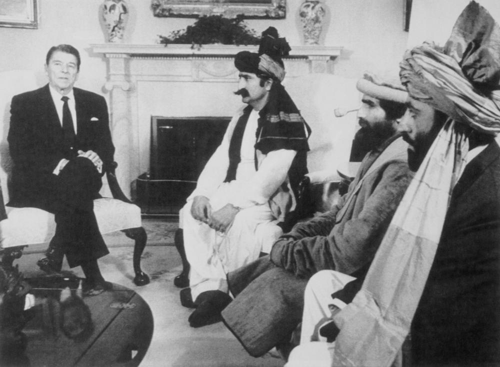 Former President Ronald Reagan meets in the Oval Office in 1983 with Afghan fighters opposing the Soviet Union.