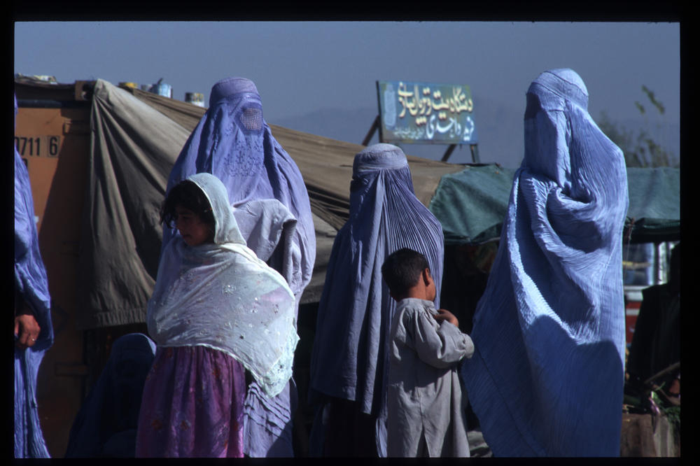 Afghan women wear Taliban-imposed burqas in Kabul.