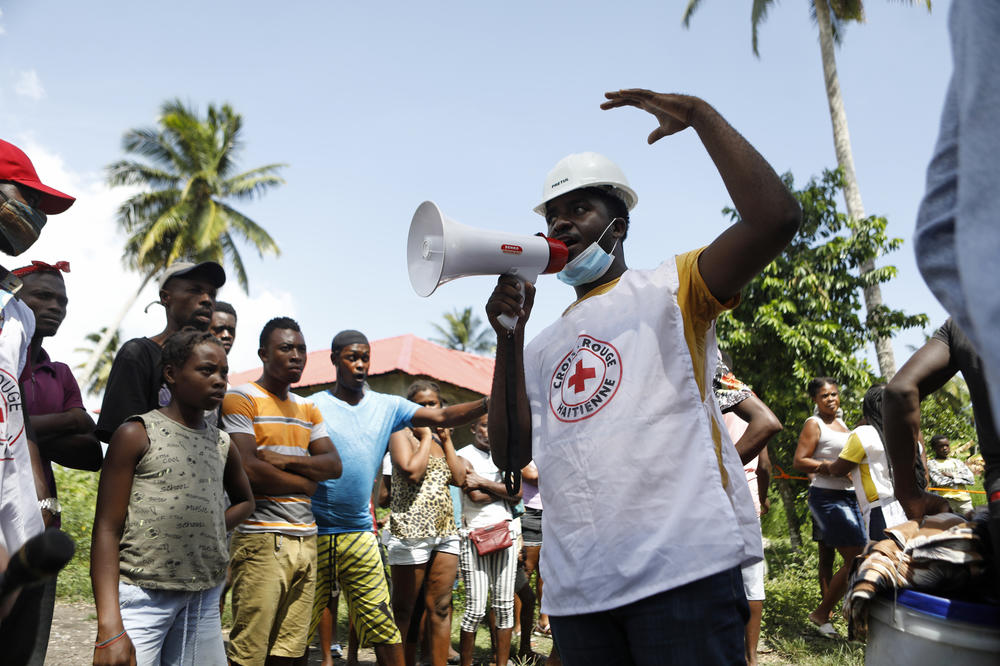Workers with UNICEF and the Haitian Red Cross prepare to distribute relief supplies in Torbeck, Haiti.