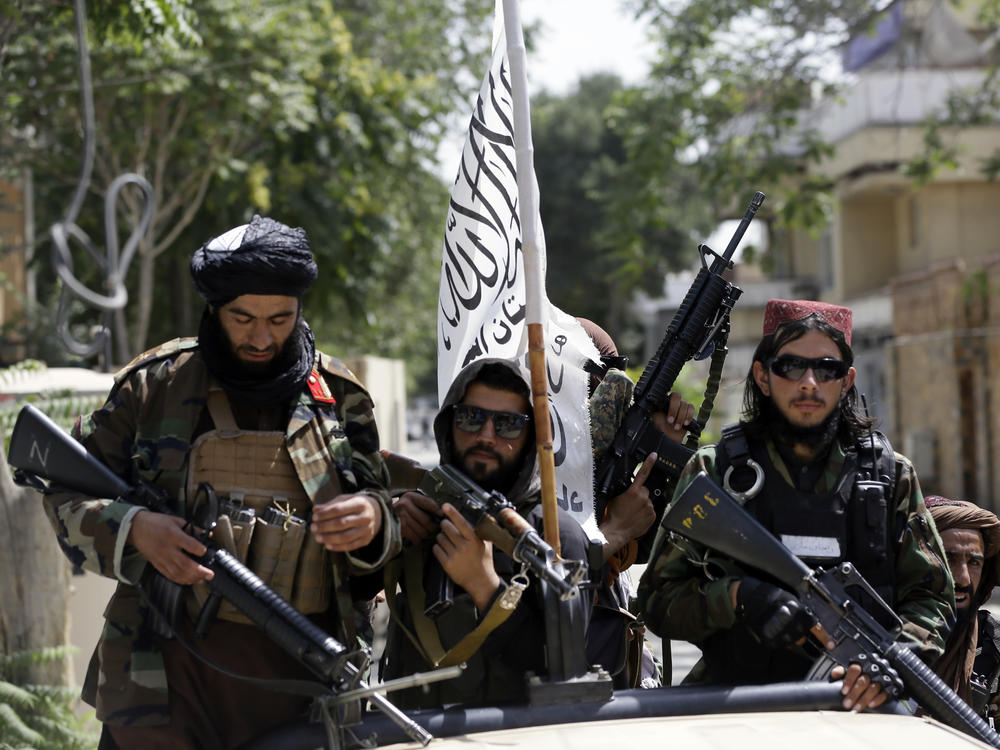 Taliban fighters patrol through Kabul, Afghanistan, on Thursday. Pictures of such fighters posing with captured aircraft, weapons and vehicles have been showing upon social media.