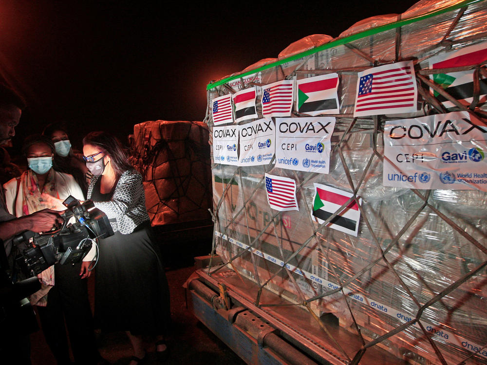 COVID-19 vaccines from COVAX, the international vaccine-sharing program, arrive in Khartoum, Sudan, on Aug. 5. In a letter to President Biden, health experts are asking him to take action to manufacture and distribute vaccines to the entire world.