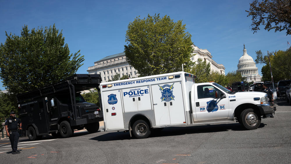 First responders arrive on the scene Thursday to investigate a report of an explosive device in a pickup near the Library of Congress in Washington, D.C.