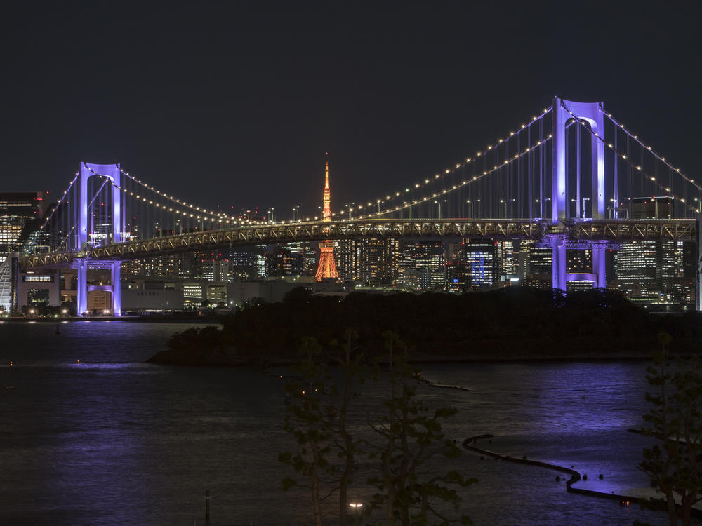 Tokyo's Rainbow Bridge is bathed in purple light on Thursday as part of the WeThe15 campaign.
