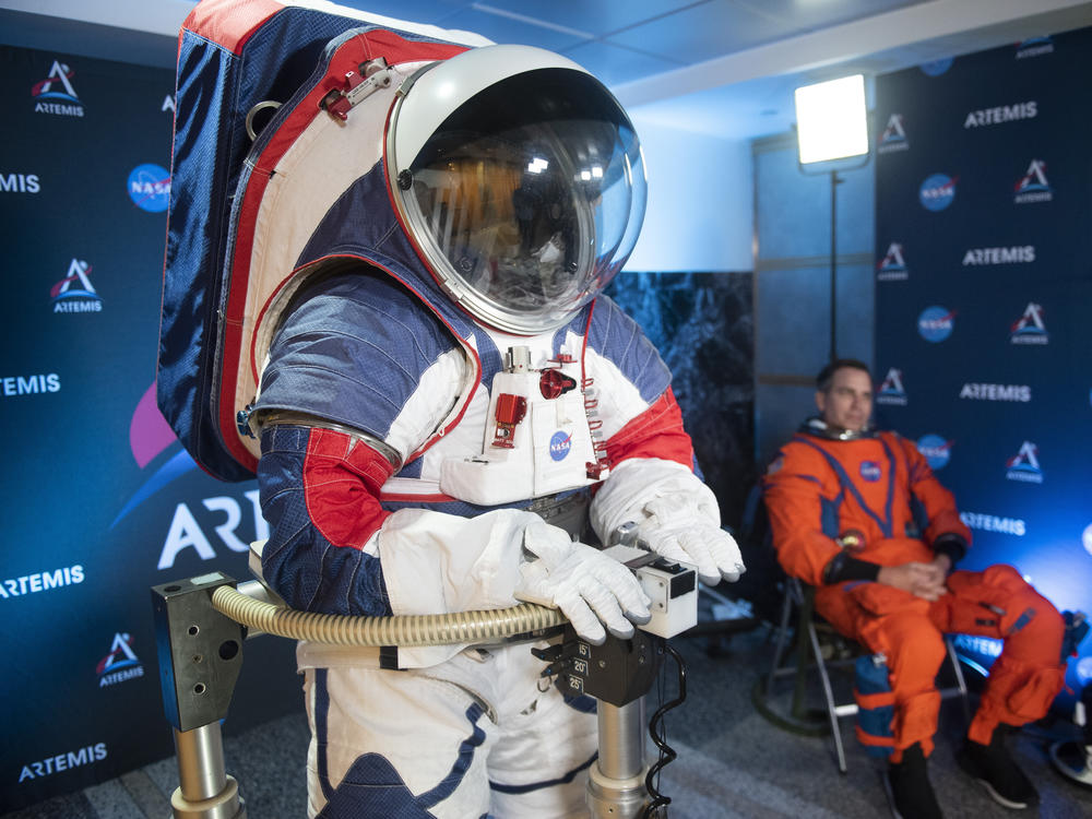 The two NASA spacesuit prototypes, one for exploring the surface of the moon's South Pole (left) and one for launch and reentry aboard the agency's Orion spacecraft, won't become a reality in time for a planned 2024 mission.
