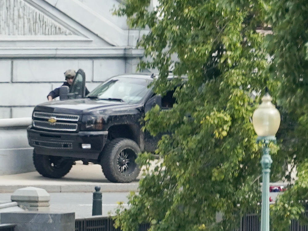 A man who claimed to have a bomb in a pickup truck near the Capitol surrendered to law enforcement after an hours-long standoff Thursday. The incident prompted a massive police response and the evacuations of government buildings and businesses in the area.