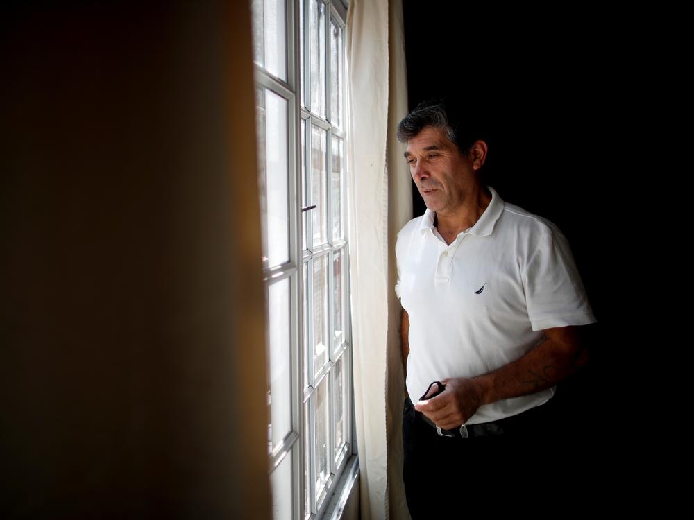 Claudio Rojas, a 55-year-old handyman who was deported from the U.S. in 2019, poses for a photo in his home in Moreno, Argentina, on May 8. His wife, two sons and two grandsons remained in Florida.