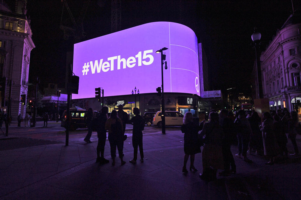 The Piccadilly Lights in London temporarily show graphics to celebrate the launch of WeThe15 campaign on Thursday.