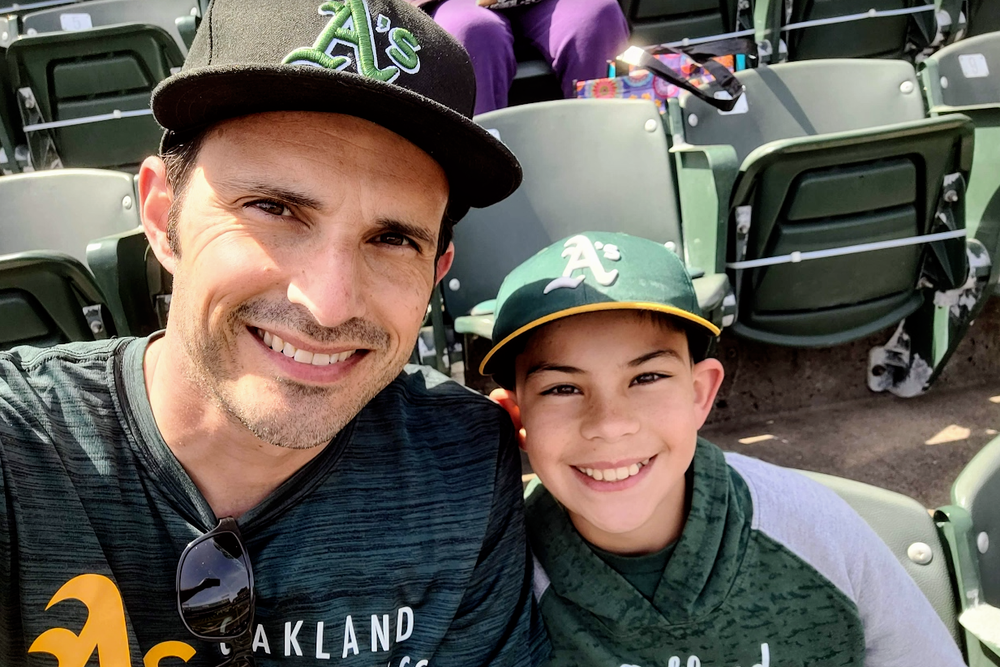 Rico Garcia and his son, Jace, enjoy a baseball game before the pandemic's start. This month, both father and son contracted COVID-19, as did Jace's mom. 