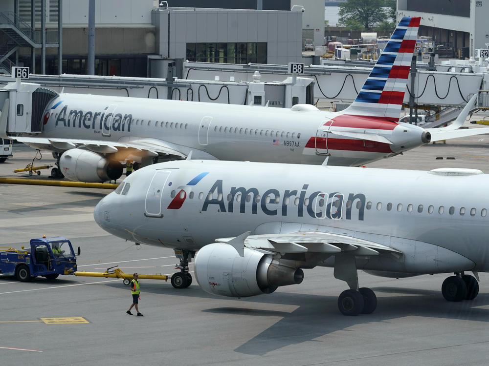American Airlines passenger jets prepare for departure at Boston Logan International Airport in July. American is one of six airlines the Pentagon is turning to for assistance with the Afghan evacuation effort.