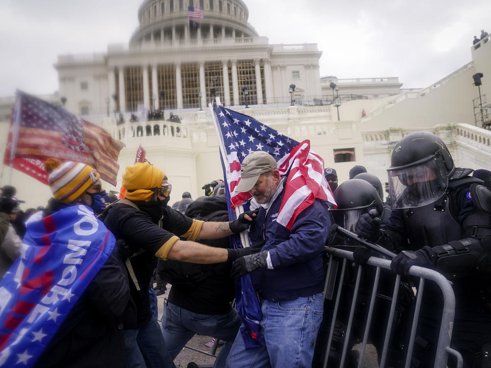 Rioters try to break through a police barrier at the U.S. Capitol on Jan. 6.