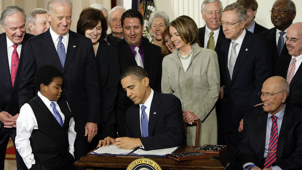 Then-President Barack Obama signs the Affordable Care Act in March 2010. Later that year, Democrats lost dozens of House seats.
