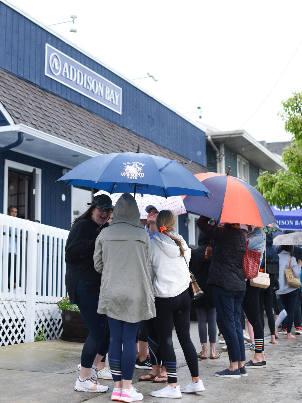 Shoppers line up for the grand opening of Addison Bay's first physical store on a rainy May day in Avalon, N.J.