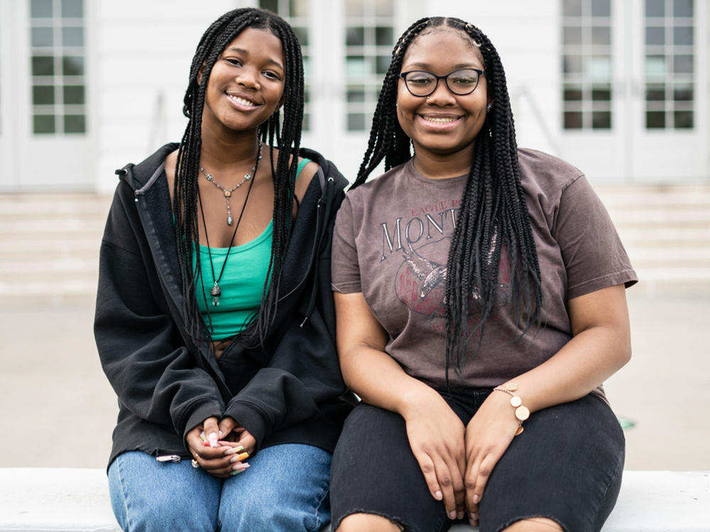 Makiyah Hicks and Jonetta Harrison in front of their high school, Duke Ellington School of the Arts, in Washington, D.C. They are finalists in this year's NPR Student Podcast Challenge for their entry 