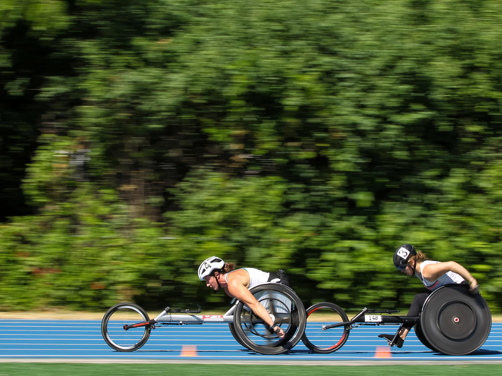 Tatyana McFadden, center, and Jenna Fesemyer of the United States compete in the Women's 5000 Meter Run T53/54 Wheelchair final during the 2021 U.S. Paralympic Trials at Breck High School on June 18, 2021 in Minneapolis, Minnesota. McFadden has won 17 Paralympic medals and is looking to pick up more in Tokyo.