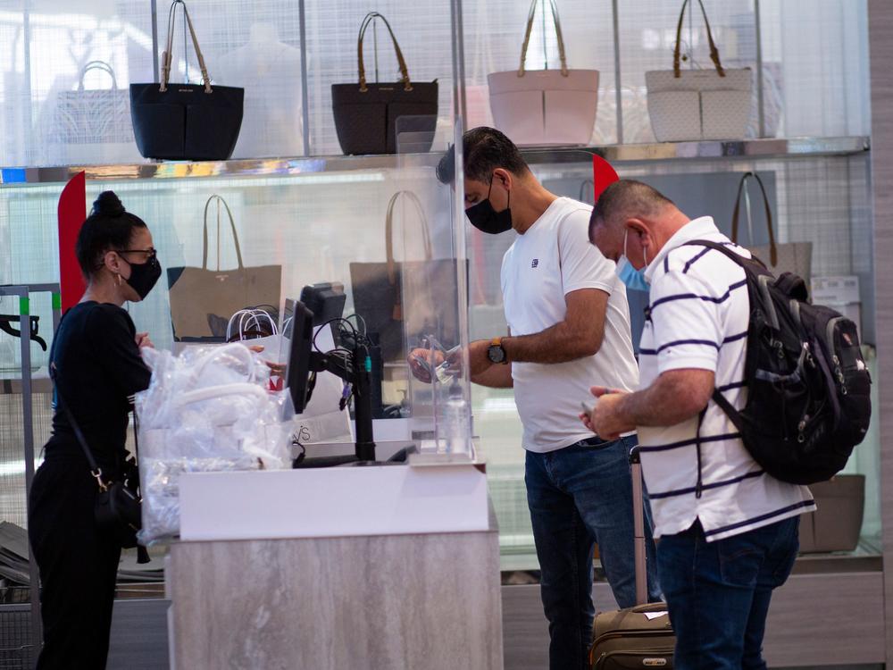 People shop at a Macy's in New York this month.