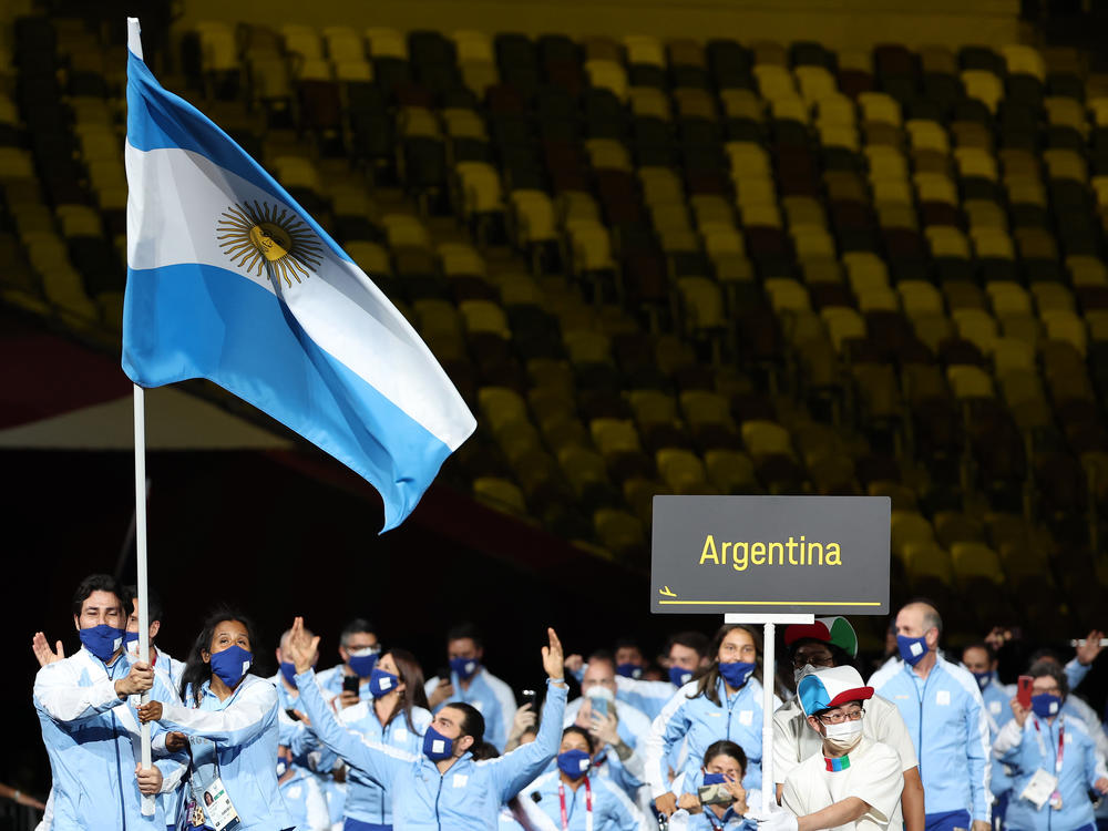 Flag bearers Yanina Andrea Martinez and Rodolfo Ramirez of Team Argentina lead their delegation in the parade of athletes.