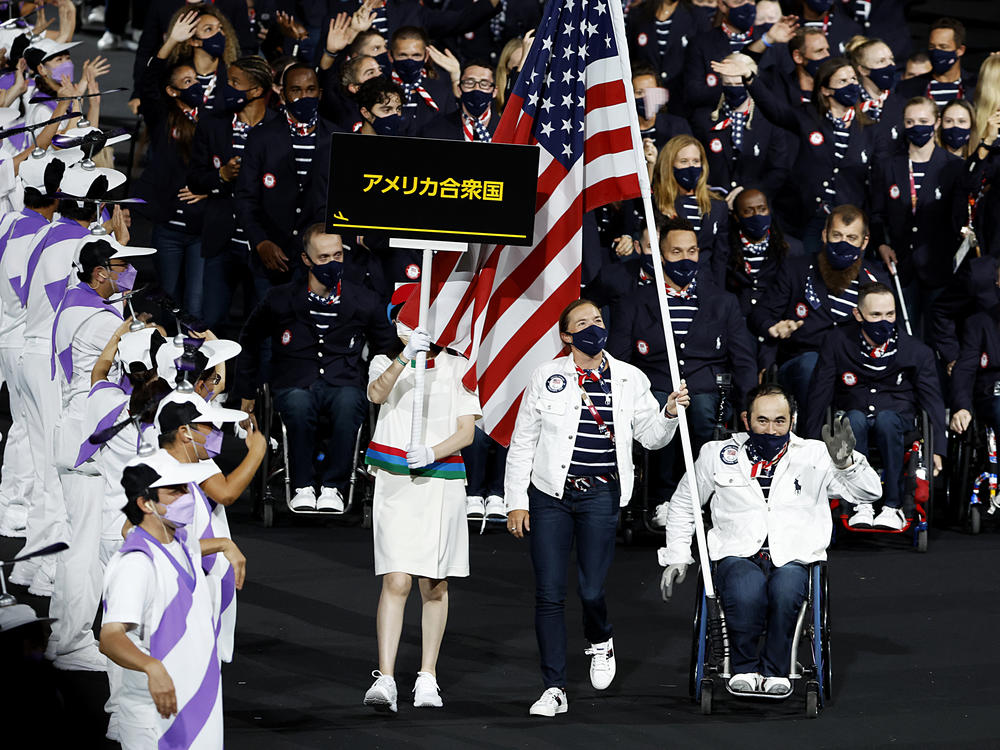 Flag bearers Melissa Stockwell and Charles Aoki of Team USA lead their delegation in the parade of athletes during the opening ceremony of the Tokyo 2020 Paralympic Games on August 24, 2021 in Tokyo, Japan.