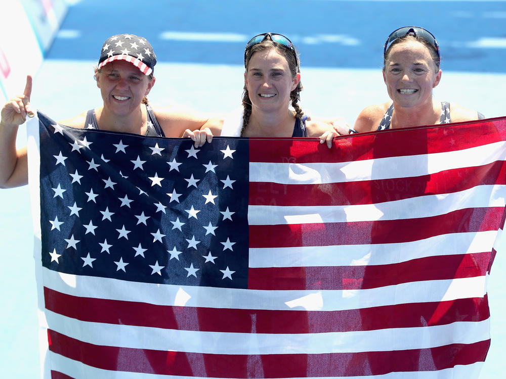 Hailey Danz (nee Danisewicz), Allysa Seely and Melissa Stockwell pose for photographers after sweeping the first three places in the women's triathlon PT2 at Fort Copacabana during the Rio 2016 Paralympic Games on Sept. 11, 2016, in Brazil. They are among the six U.S. athletes that swept the podium in Rio and are competing again in Tokyo.