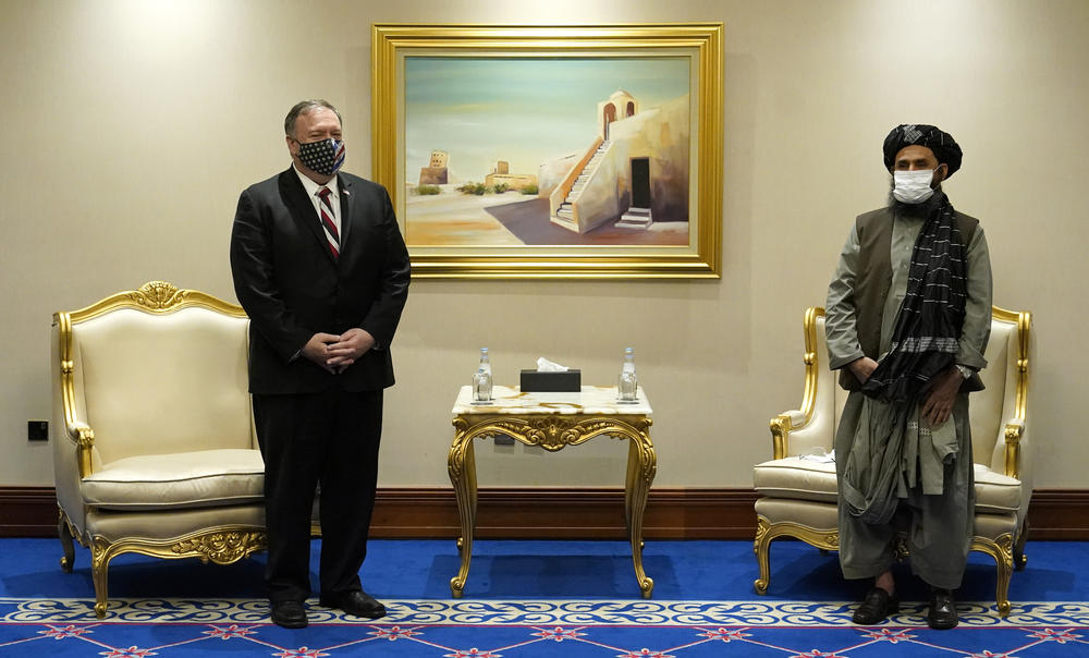 Then-Secretary of State Mike Pompeo meets Mullah Abdul Ghani Baradar, head of the Taliban's negotiation team, in talks on Nov. 21, 2020, in Doha, Qatar.