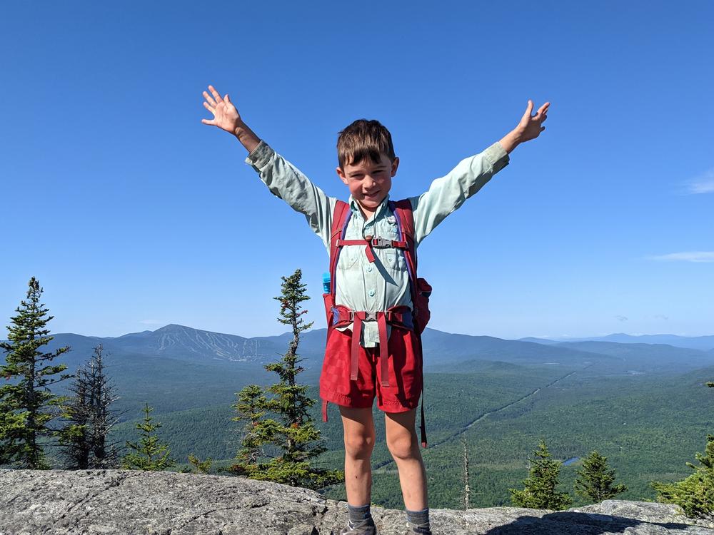 In this July 23 family photo, 5-year-old Harvey Sutton raises his arms while hiking the Appalachian Trail with his parents, Josh and Cassie Sutton.