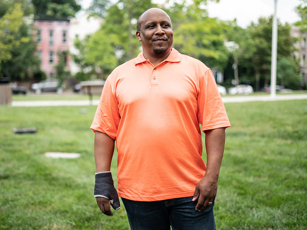 Thom Woodward stands in front of Duke Ellington School of the Arts located in Washington, D.C. where he teaches. Woodward guided his student Jonetta Harrison, Makiyah Hicks and Quin Wells in creating the first podcast title 