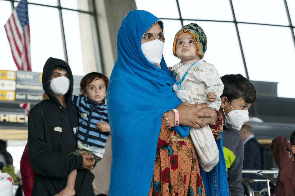 <strong>Thurs., Aug. 26: </strong>Families evacuated from Kabul, Afghanistan, after they arrived at Washington Dulles International Airport, in Chantilly, Va.
