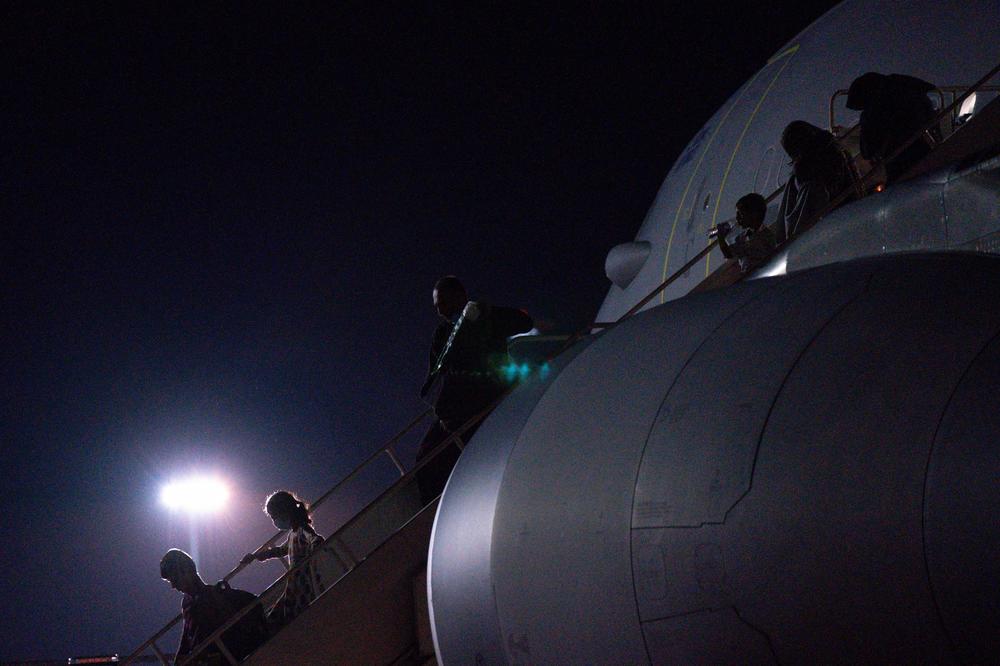 <strong>Mon., Aug. 16: </strong>Passengers evacuated from Afghanistan disembark a British military transport aircraft at RAF Brize Norton station in southern England.