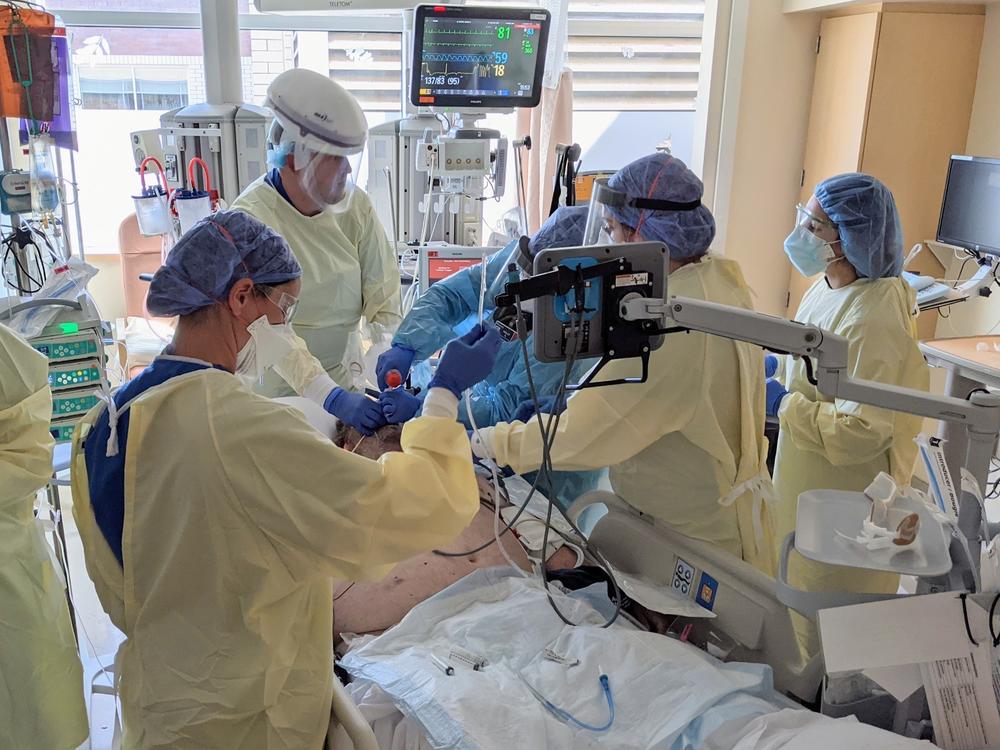A team at Asante Rogue Regional Medical Center in southern Oregon prepares to intubate a COVID-19 patient.
